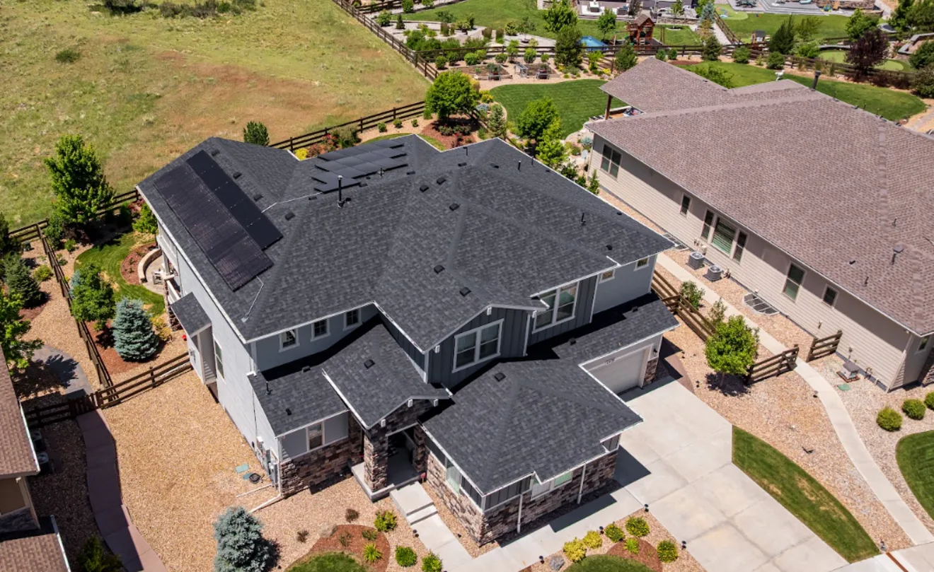 Aerial view of a Colorado home with a rooftop solar array