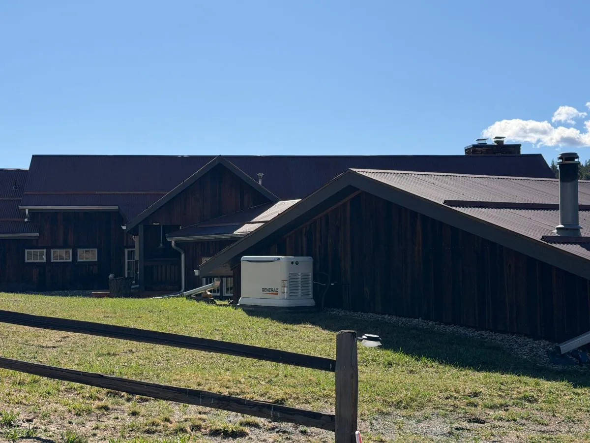 Generac standby generator installed beside a Colorado ranch-style home