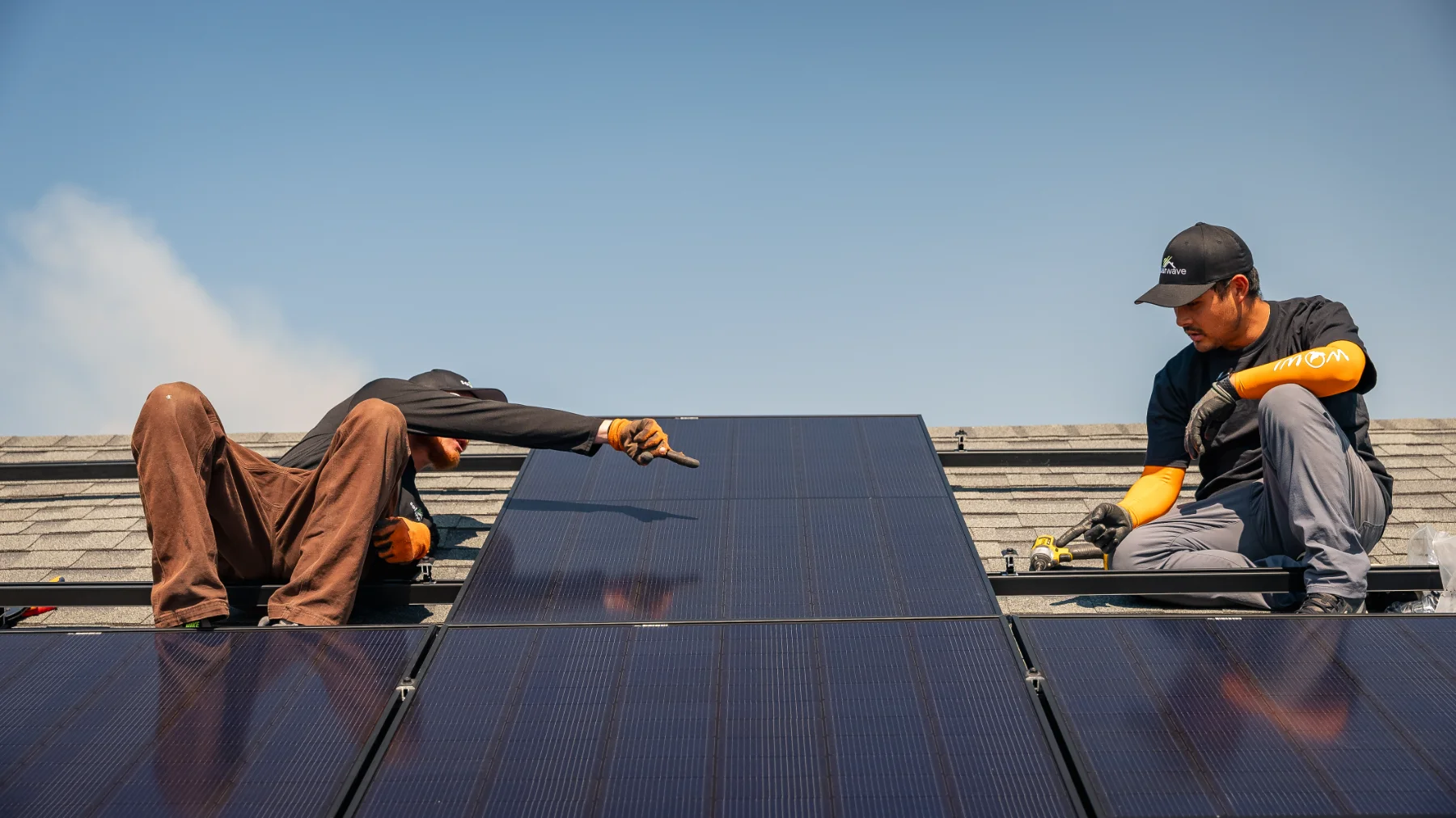 Solar Wave technician servicing a rooftop solar system