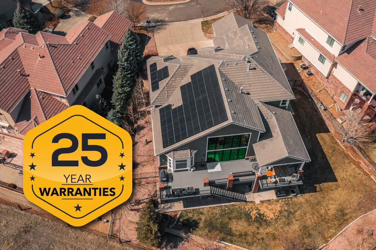 Aerial view of a completed Solar Wave installation with a 25-year warranty badge